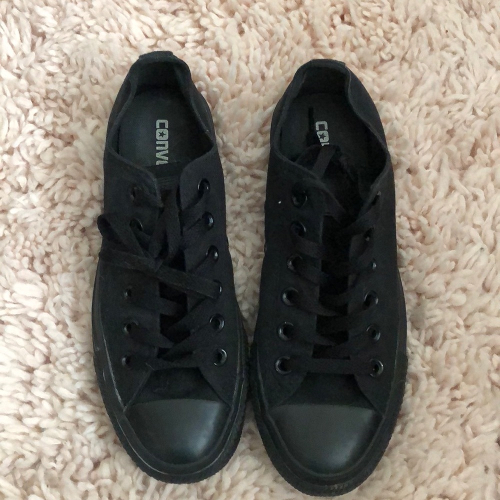 All black low top Chuck Norris Converse